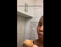 Woman poses with chicken then eats it