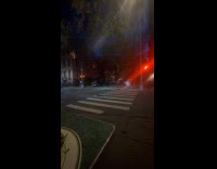 Submitter shows musician playing cello across street