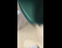 Mouse inside of classroom runs out from under cabinet 