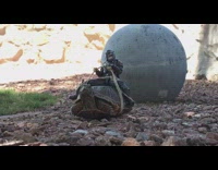Mandalorian action figure sits on turtle outdoors  