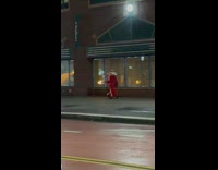 Man sombrero red robe hold burning wood