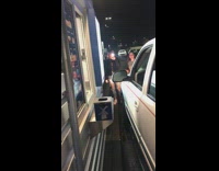 Guy jumps through drive thru window into car window