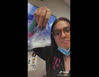 Girl has ziplock bag of white liquid coconut oil