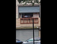 Man white shirt nap on second floor window