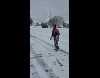 Guy jacket jump face forward on snow