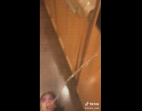 Girl laying on floor water shoots out of fridge 