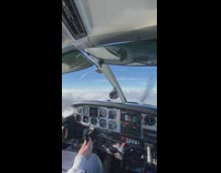 POV of small plane flying above the clouds in the U.K. 

