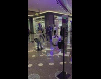 Man sleep inside shiny bathtub middle mall