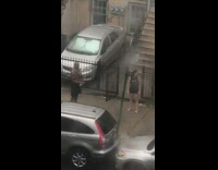 Man and woman take a shower in the rain outside
