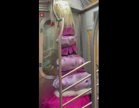 Retractable purple insect monster halloween costume on subway train