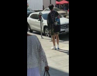 Guy has photoshoot on sidewalk