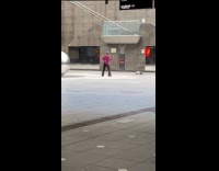 Collab IITW - Woman pink top dances outside train station