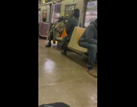 Fashionable Man in Leather Attire Rides Train