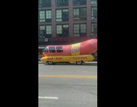Long Oscar Mayer hotdog car parked on street