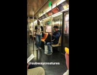 Pink killer bunny with scary white mask on subway train