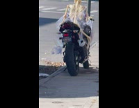 Skeleton sits on the motorcycle alone day at NY 