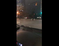 Guy pushes girl on luggage cart crosswalk 