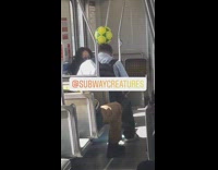 Guy balances soccer ball on head train 