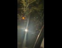 Man drive and another guy carry motorcycle on his back 