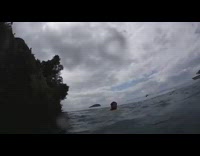 Guy front flip lands back lake cliff 