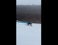 Guy skiing does trick falls off ground