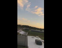 Red shirt white pants RV roof girl 