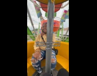 Woman with weird girl at fair ride