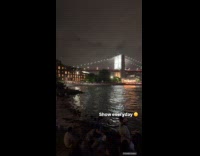 People at shore near Manhattan bridge accident