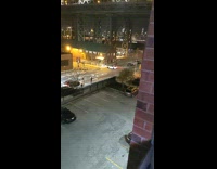 Blue bus honks at white car donuts 