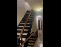 Rain water leaks inside apartment building stairs