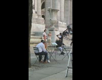 Woman white shirt pose near grail starue