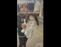 Little girl holding spooky doll says she is haunted
