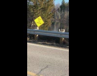 Guy hits head on yellow watch for children sign 