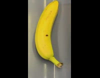 Girl wearing doc martens sits next to leftover banana on subway train