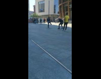 Girl grey skirt dance street pavement bike