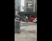 Guy rides penny farth big bike 