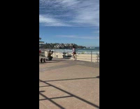 Girl red dress lift skirt beach railings