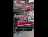 Guy shakes maracas in car