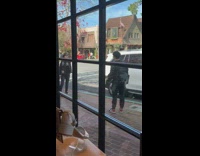 Person holding hand out in street picture