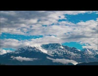 Time lapse Fishtail mountain with clouds snow