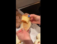 Woman shows how to eat cupcake icing