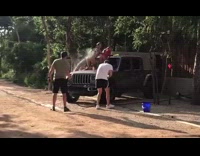 Two women bikini flex butt car wash