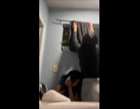 Woman inside bathroom hits with fallen towel pole