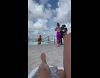 Woman red hair swimsuit at rooftop pool