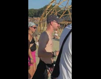 Woman kneel pose beside wooden half sphere