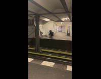 Two girls kneel mirror selfie subway station
