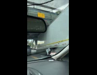 Truck white container crushed under the bridge