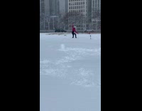 Girl throws snow for photo during blizzard 