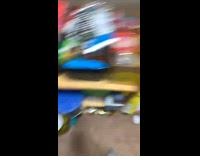 Girl holding cat after it ate bag of sugar 