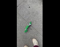 Man smoke cigarette in green elf costume toy